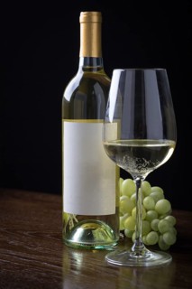 Wine glass and bottle with blank label ready for graphic and text