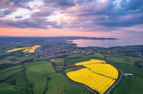 Sunset over Devon Fields and Farmlands from a drone