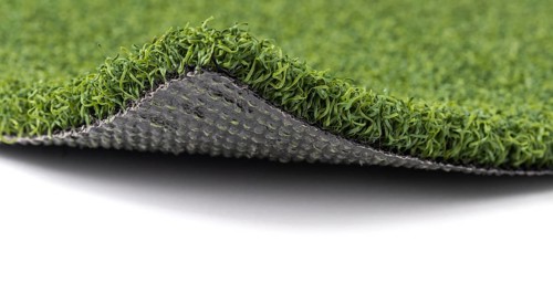 Flipped up section of artificial turf grass on white background