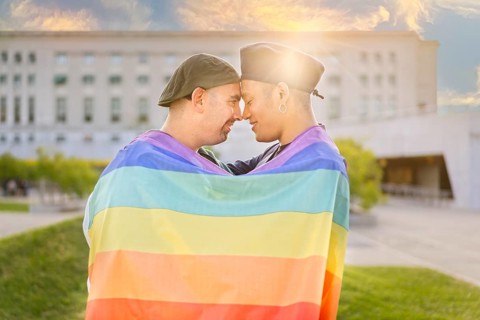 Couple of gay men in love embracing each other