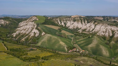 Aerial view of a hilly landscape with erosion valleys