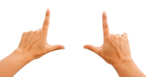 Female hands making frame isolated on a white background with clipping paths for your own positioning