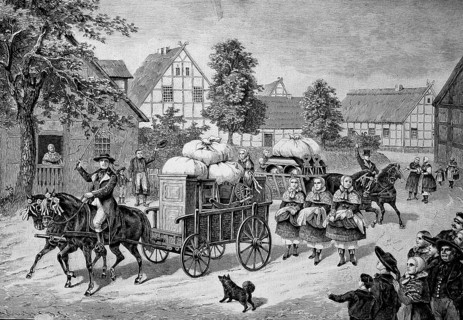 The bride's beds are driven through the village by a wagon