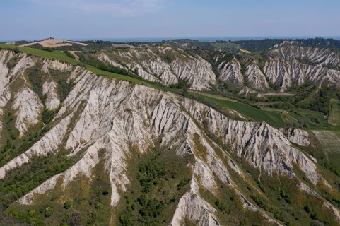 Aerial view of a hilly landscape with erosion valleys