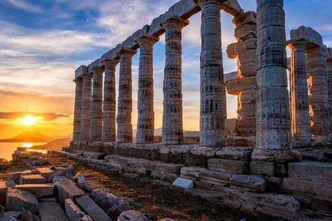 Sunset at Cape Sounio near Sounion with the ruins of the famous Temple of Poseidon