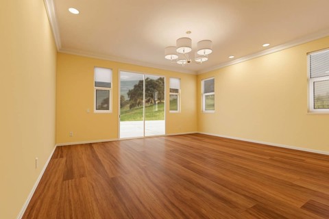 Newly remodeled room of house with finished wood floors