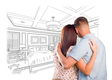 Curious young military couple looking over custom bedroom design drawing