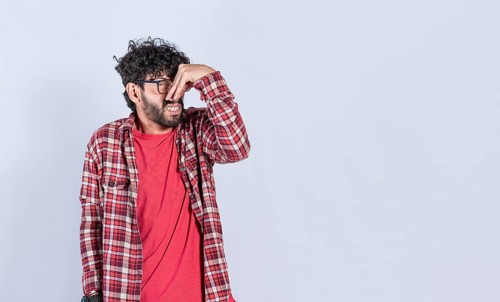 A man with covering his nose