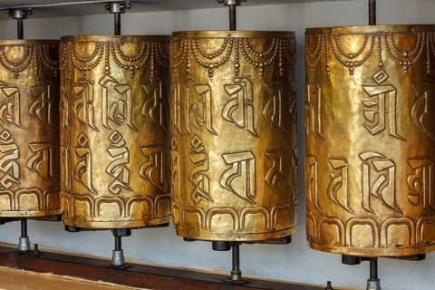 Metal buddhist prayer wheels in Tsuglagkhang complex in Dalai Lama residence