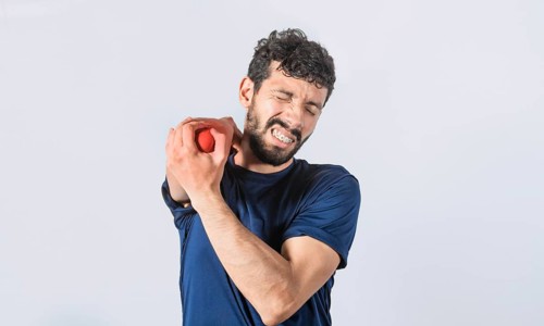 Man with elbow cramp