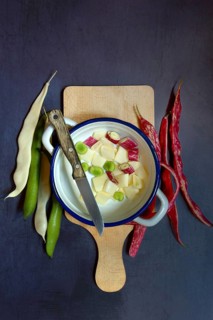 Assorted beans in pot with knife