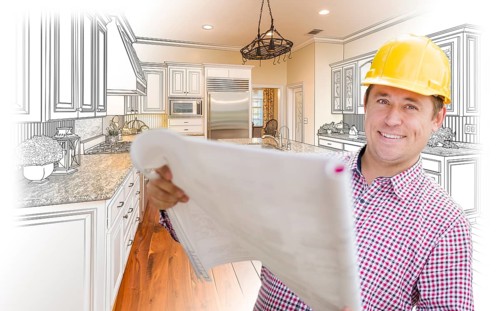Smiling contractor holding blueprints over custom kitchen drawing and photo combination