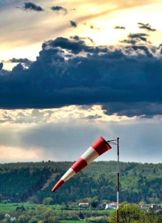 Windsock and cloudy sky