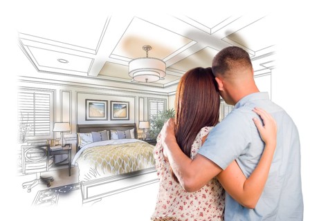 Curious young military couple looking over custom bedroom design drawing photo combination