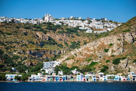 Klima and Plaka villages with whitewhashed traditional houses and orthodox church and windmills on Milos island
