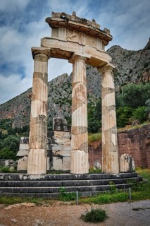 Tholos with Doric columns at the sanctuary of Athena Pronoia temple ruins in ancient Delphi