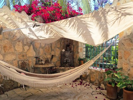 Romantic corner with hammock and awning