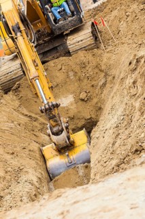 Working excavator tractor digging A trench