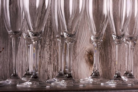 Champagne flutes on shelf abstract