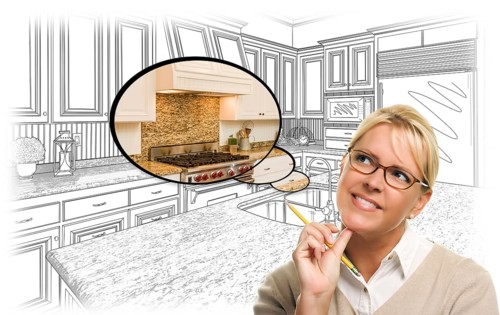 Creative woman with pencil over custom kitchen drawing and thought bubble photo combination