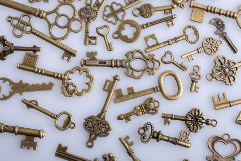 Retro style metal keys on a white background