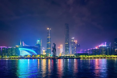 Guangzhou cityscape skyline over the Pearl River illuminated in the evening. Guangzhou