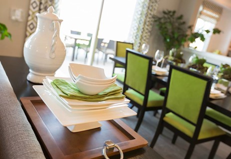 Beautiful dining area of home with apple green accents