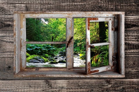 View through a rustic wooden window into the Wutach Gorge