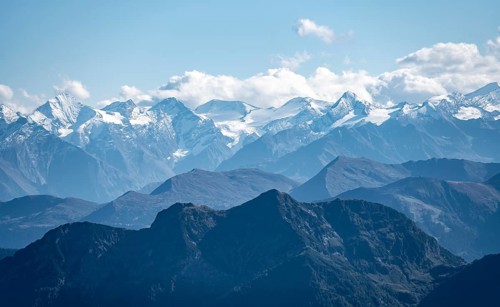 Snow-covered mountain peaks on the main ridge of the Alps