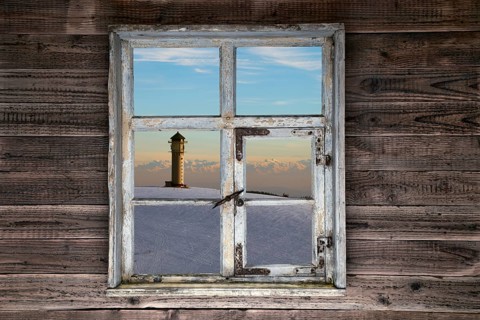 View through a rustic wooden window to the Feldberg tower