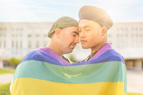 Couple of gay men in love embracing each other
