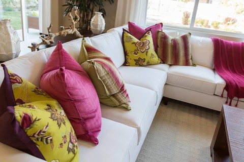 Beautiful abstract of inviting colorful couch sitting area and table