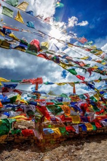 Prayer flags with Buddhist mantra on them at high Kunzum La pass