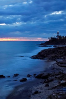 Kovalam Vizhinjam lighthouse on beautiful Arabian sea coast during sunset