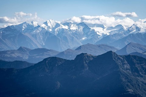 Snow-covered mountain peaks on the main ridge of the Alps