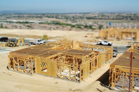 Aerial view of new homes construction site with tilt-shift blur