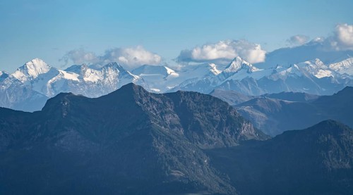 Snow-covered mountain peaks on the main ridge of the Alps