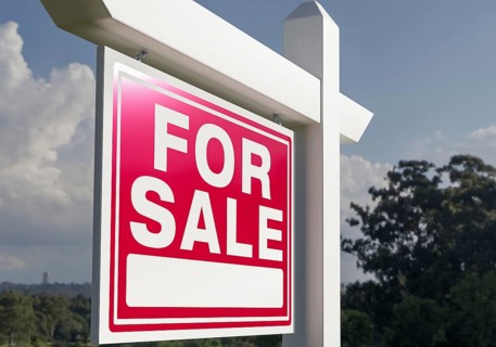 Close-up of house for sale real estate sign