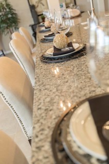 Beautiful abstract of interior kitchen counter place settings and chairs