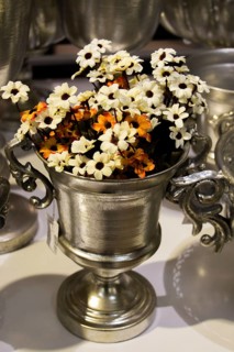 The Flower pot with beautiful fake flowers in it
