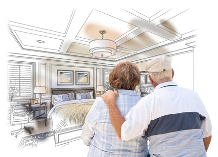 Curious senior couple looking over custom bedroom design drawing photo combination