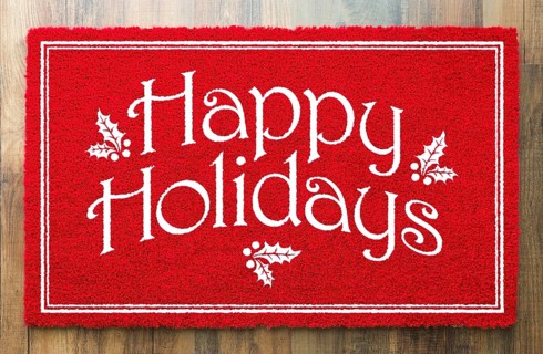 Happy holidays christmas red welcome mat on wood floor background
