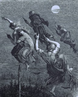 Witches riding a broom through the night