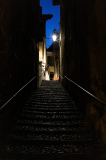 Narrow dark alley with stairs in Cannobio
