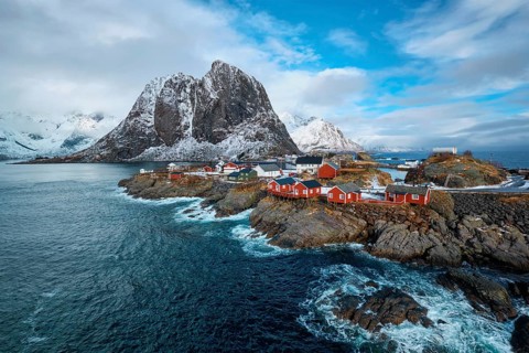 Hamnoy fishing village with red rorbu houses in Norwegian fjord in winter. Lofoten Islands