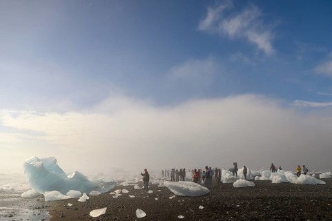 Ice and tourists on the beach