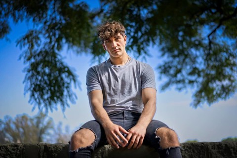 Confident young blonde man portrait