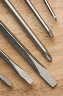 Series of screwdrivers on a wood background