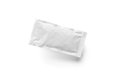 Blank white condiment packet floating isolated on white background