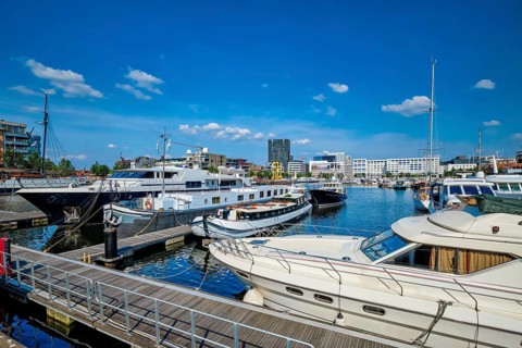 Yachts and boats moored in Willemdock in Antwerp